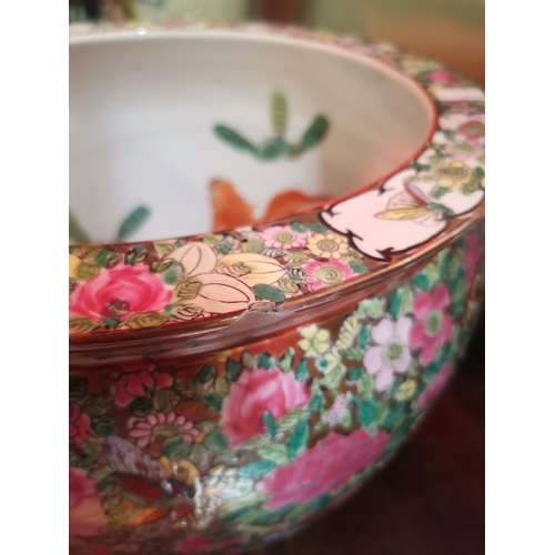 126 - A famille rose style 24cm bowl with fish decoration to the interior