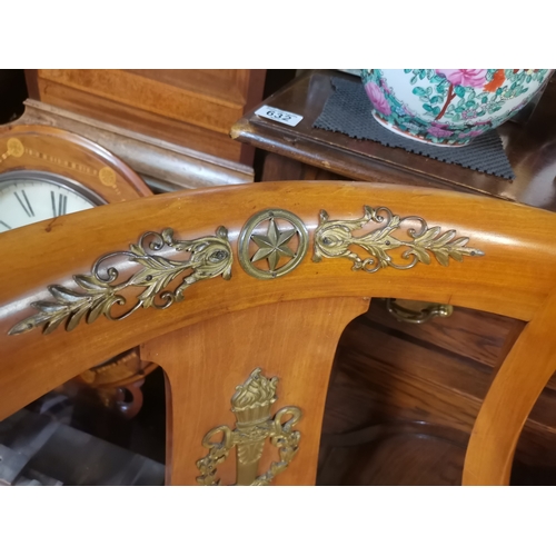 630 - A fine pair of fruitwood hall chairs with canework seats, variously applied with ornate brass decora... 