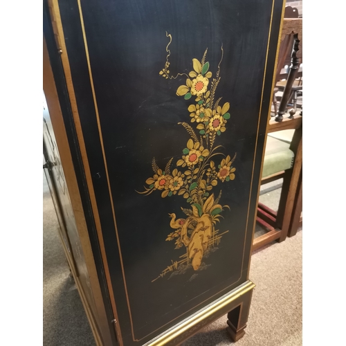 661 - A Chinese style black lacquer drinks cabinet with highly decorative floral detail, female figures, p... 