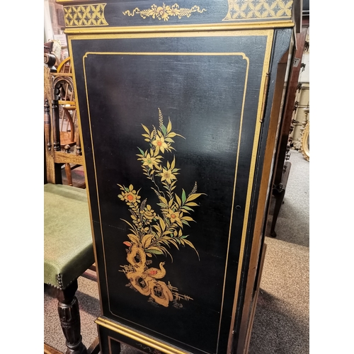 661 - A Chinese style black lacquer drinks cabinet with highly decorative floral detail, female figures, p... 