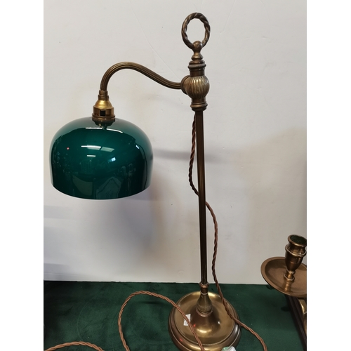 60 - A vintage brass extending desk lamp with green shade plus a brass candlestick