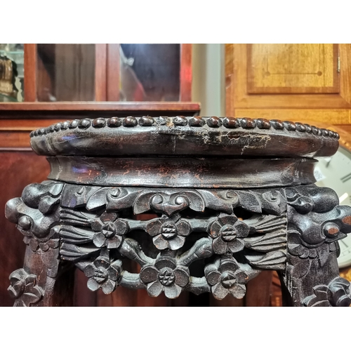 629 - A 60cm high Antique rosewood pot stand with highly decorative floral decoration