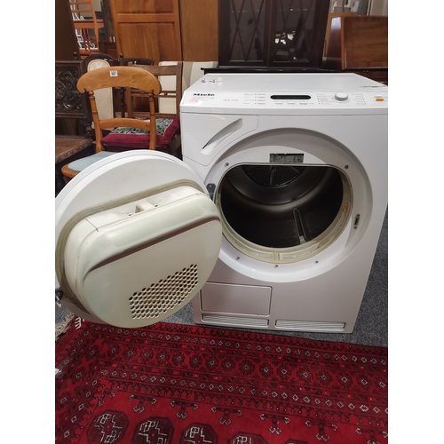 905 - A Miele tumble dryer, Honeycomb Care T9246C. 83.5cm high, 59.3cm wide