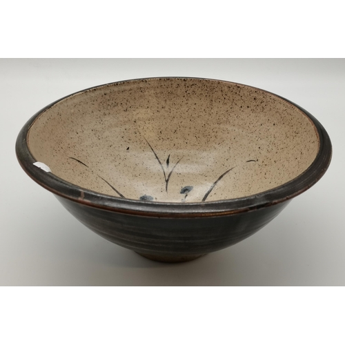 125 - A Leach Pottery, St.Ives large stoneware bowl, decorated with flowers to the well, black rim and ext... 