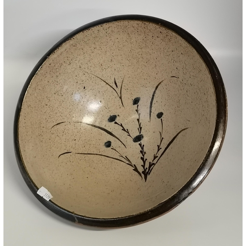 125 - A Leach Pottery, St.Ives large stoneware bowl, decorated with flowers to the well, black rim and ext... 