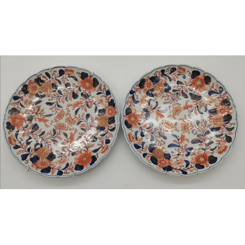 141 - A pair of Japanese Imari wall chargers, with scalloped edges, impressed marks verso. (2) 30.7cm diam... 