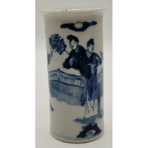 202 - A Chinese porcelain blue and white cylindrical sleeve vase, decorated with figures in a garden, four... 