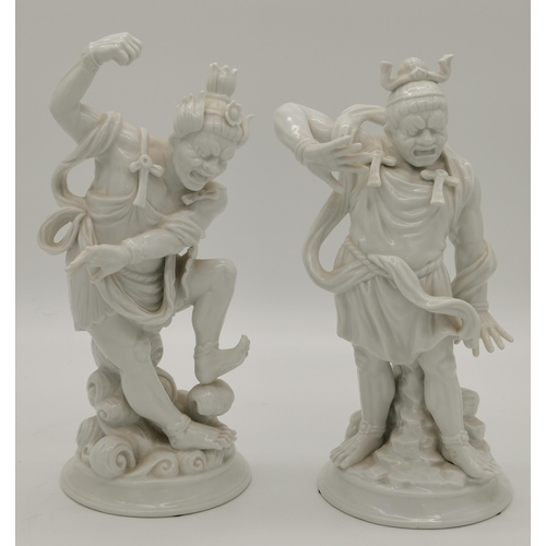 215 - A pair of Blanc de Chine porcelain Chinese warrior figures by Fitz & Floyd, impressed marks to base,... 