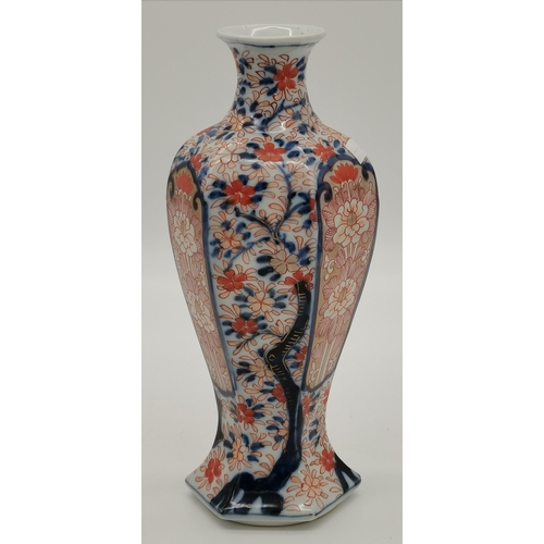 219 - A Japanese Imari porcelain jar with cover, and a matching vase, both hexagonal baluster. (2) Jar 30.... 