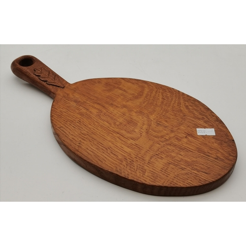 230 - An Oakleafman oak cheese board and cheese knife, the board lightly adzed, carved oak leaf signature ... 