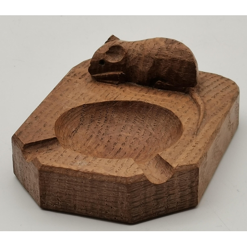 231 - Robert Thompson, a Mouseman oak ashtray, of typical form, with carved mouse signature. 10.1cm by 7.6... 