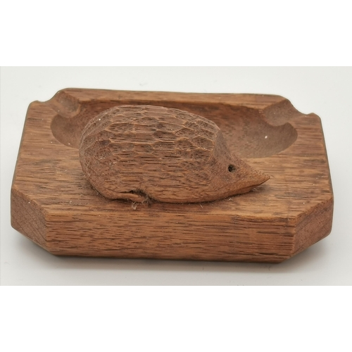 237 - Nick Hill, a Hedgehogman oak ash tray, rectangular with canted corners, lightly adzed, with carved h... 