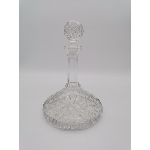 251 - A large cut-glass ship's decanter, with globular stopper and star-cut flat base. 28.5cm high