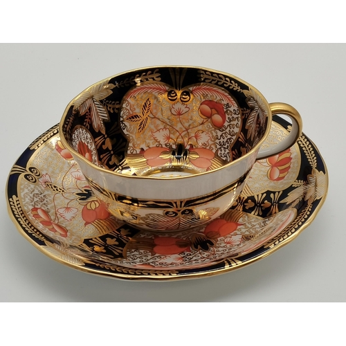 269 - A Royal Crown Derby part tea service comprising six cake plates, tea cups and saucers, Imari pattern... 