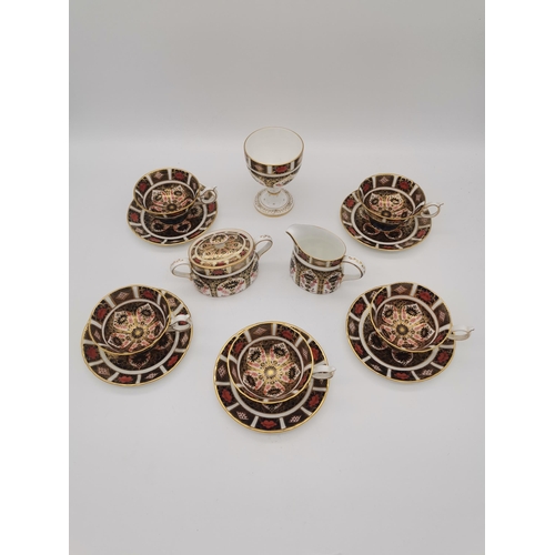 283 - Collection of 13 pieces of Royal Crown Derby Imari pattern 1128 incl 5 cups and saucers, cream jug, ... 