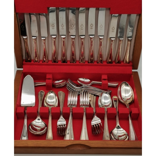 402 - A canteen of silver-plated flatware for six persons, Bead pattern, in a fitted wooden case, with add... 