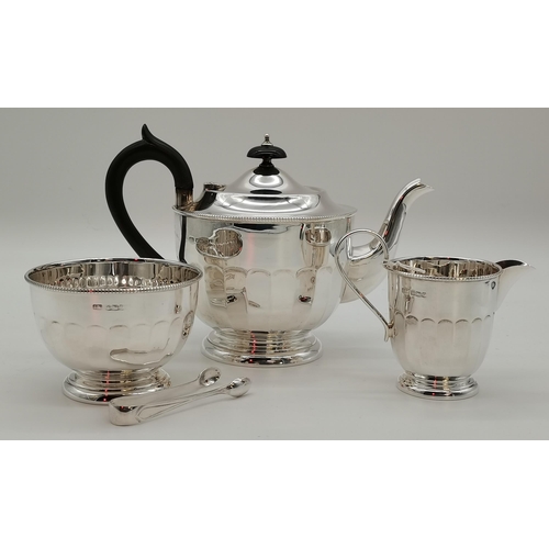 410 - A George V silver three-piece tea service by Emile Viner, Sheffield 1932, comprising teapot, sugar a... 