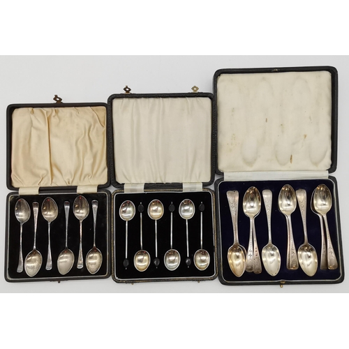 411 - Three assorted sets of silver tea and coffee spoons, 20th Century, comprising twelve George V silver... 