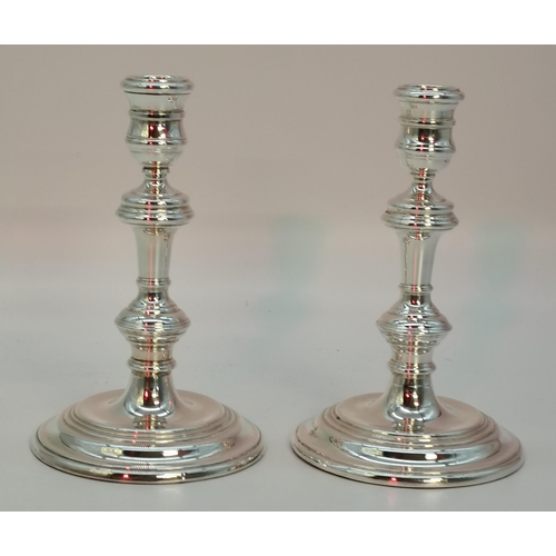 414 - A pair of Elizabeth II silver candle sticks by Richard Comyns, London 1969, George I style, the doub... 