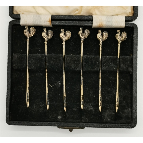 415 - A set of six George VI silver cocktail sticks by Walker & Hall, Birmingham 1949, with gilt cockerel ... 