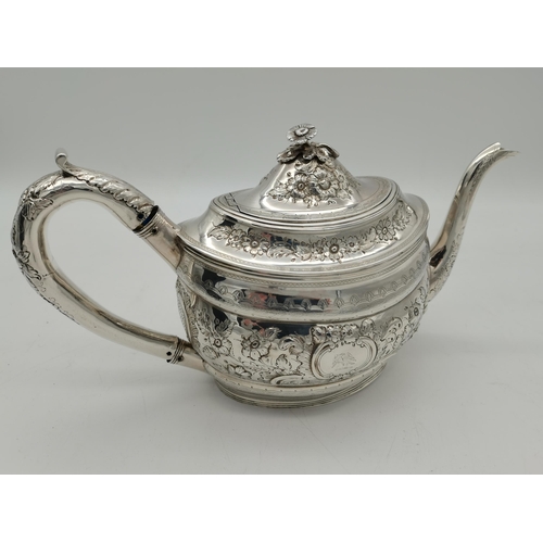 417 - A George III silver teapot by Peter, Ann & William Bateman, London 1805, oval, chased with scrolling... 