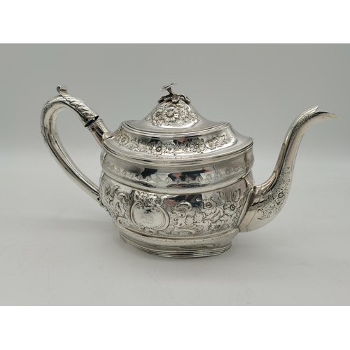 417 - A George III silver teapot by Peter, Ann & William Bateman, London 1805, oval, chased with scrolling... 