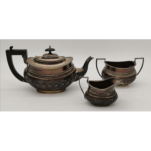 419 - An Edwardian silver three-piece tea service by William Aitken, Birmingham 1908, comprising a teapot,... 