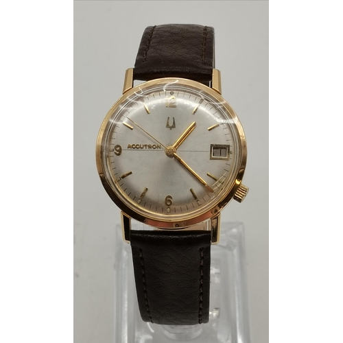 525 - A gent's Bulova Accutron leather strap wristwatch, the oyster dial with gilt hour markers and Arabic... 