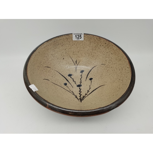 125 - A Leach Pottery, St.Ives large stoneware bowl, decorated with flowers to the well, black rim and ext... 