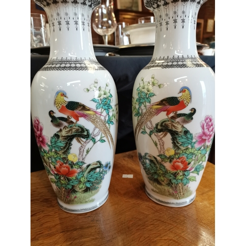 223 - A pair of Chinese porcelain vases, 20th Century, baluster with black patterned trumpet necks, each d... 