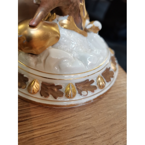 227 - A Royal Worcester porcelain nautilus shell centrepiece, cream with gilt decoration, to a coral-form ... 