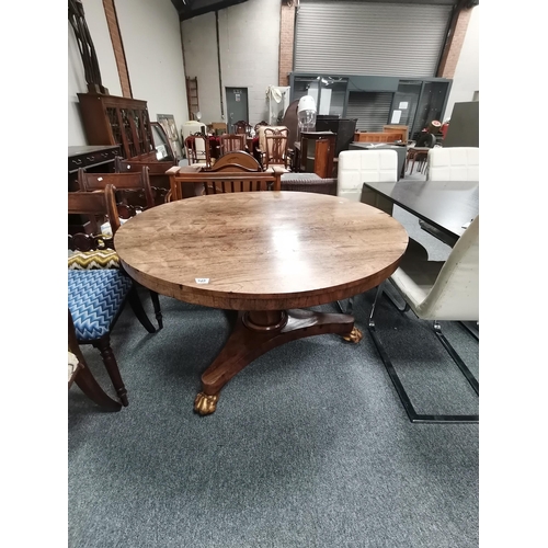 949 - William 4th Rosewood  fold over round dining table sat on Claw feet with castors D118cm and cutlery ... 