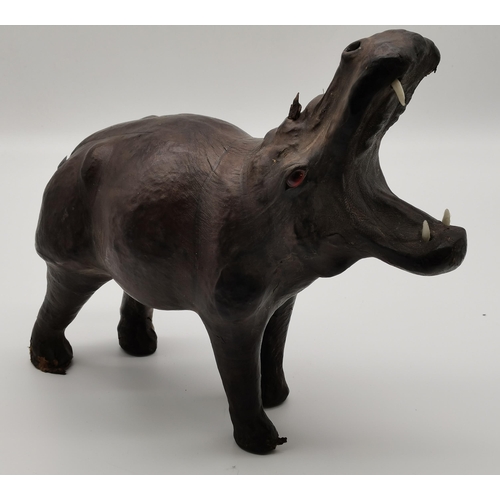 1 - A large Liberty-style leather hippopotamus standing with mouth agape, with plastic teeth; together w... 