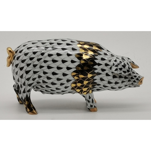 100 - A Herend porcelain pig, decorated in black, white and gold, blue printed factory marks to feet, Firs... 