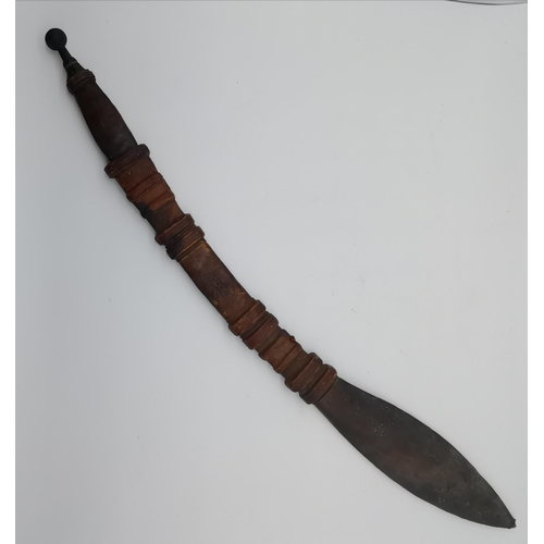 20 - An African Mandingo sword, the curved blade with leather-bound grip and metal pommel, in a leather s... 