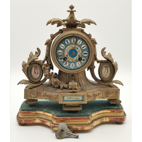 21 - A French gilt metal and enamel mantel clock, the blue enamel circular dial with black Roman numerals... 