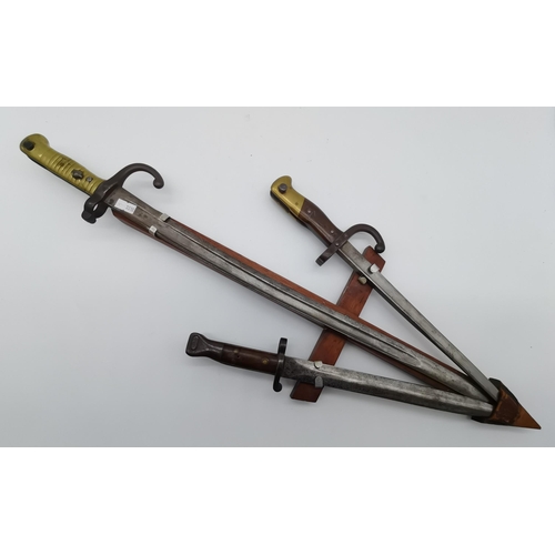 27 - Three WWI bayonets comprising a British Pattern 1888 Mk.1 Sword Bayonet (2nd type), for Lee Enfield ... 