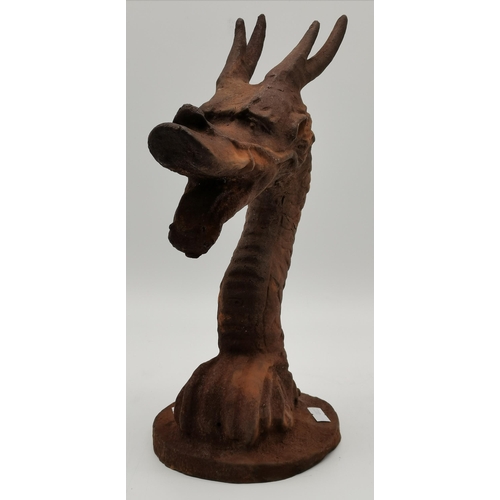 36 - A cast iron dragon head door stop. 32.5cm high