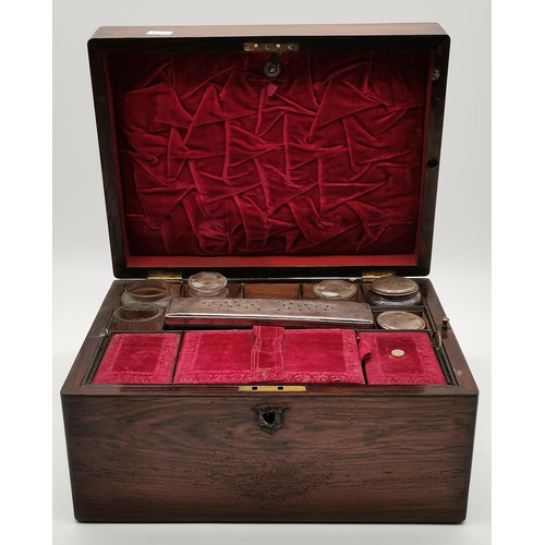 37 - A wooden travel vanity case with fitted interior, with silver-plate covered glass jars; together wit... 