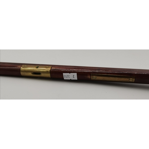 4 - A military pace stick with brass fittings, name plaque engraved (heavily rubbed). 101cm long