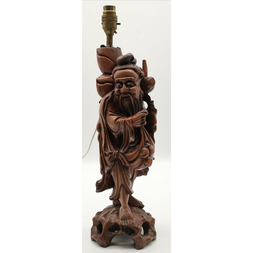 5 - A Chinese rootwood figural carved lamp base, depicting a male carrying fruit; together with a Chines... 