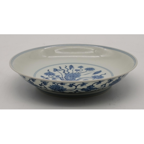 56 - A Ming style Chinese blue and white dish 20cm with six character mark and having floral decoration