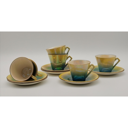 100 - A set of six Art Deco Royal Winton Grimwades lustre teacups and saucers, graduated green-yellow deco... 