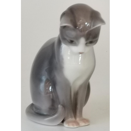 108 - A Royal Copenhagen porcelain model of a cat, green and blue printed factory marks to base, no. 500. ... 