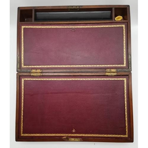 11 - A large Victorian mahogany writing box with maroon gilt-tooled leather slope, fitted with compartmen... 