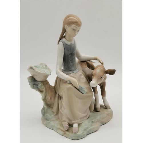 115 - Three Lladro figure and animal groups, comprising girl seated with calf, girl kneeling with lamb, an... 