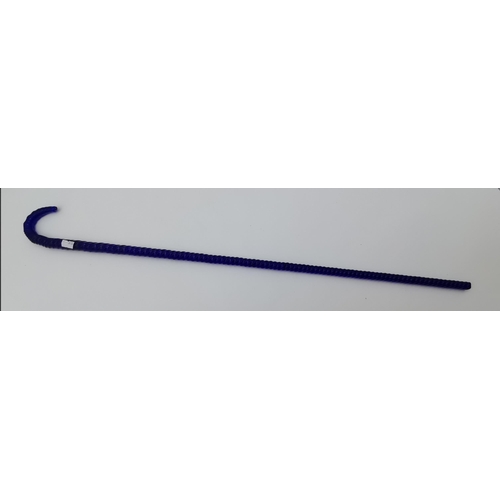 12 - A Victorian 'end of day' blue glass walking cane, the twisted shaft with loop handle. 75cm long