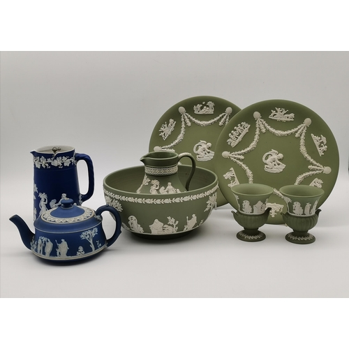 123 - A collection of Wedgwood green and blue jasperware comprising a blue lidded jug and teapot, and a gr... 