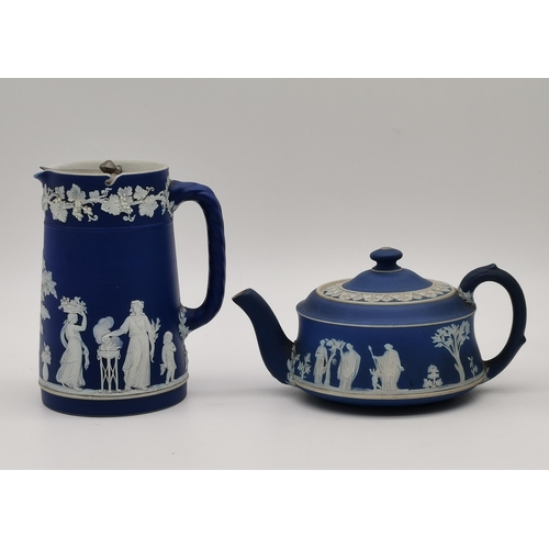 123 - A collection of Wedgwood green and blue jasperware comprising a blue lidded jug and teapot, and a gr... 