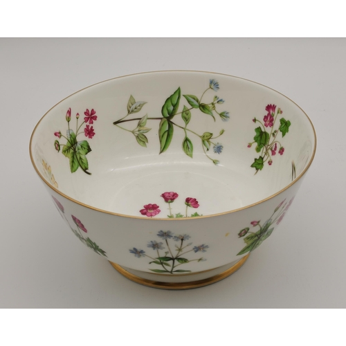 129 - A Minton pedestal bowl (O.A.2111), decorated with assorted floral sprays, with gilt rims; together w... 